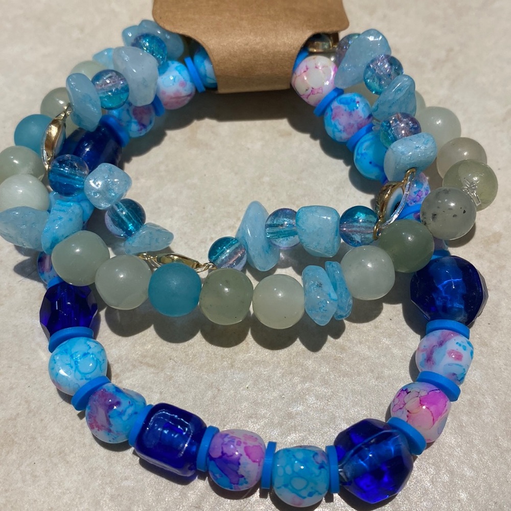 Bundle of three assorted beaded bracelets, glass, acrylic and polymer clay beads